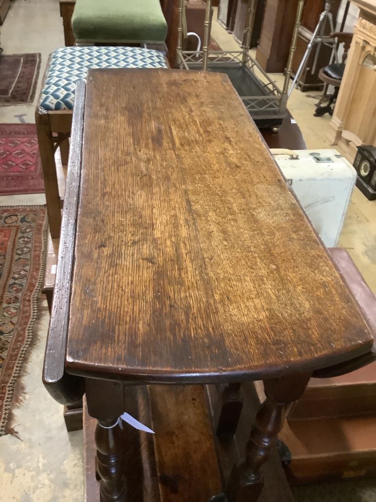 A small early 18th century oak gateleg table, width 76cm, 89cm extended, height 73cm